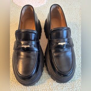 Maje Leather platform loafers with the Maje Clover detailing